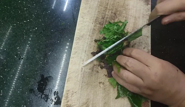 Add perilla leaves or water spinach just before turning off the heat.
