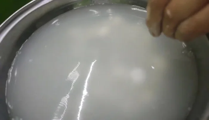 Remove the cooked Banh Troi and place them in a separate pot of cold water.