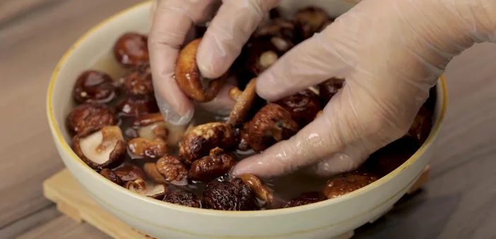 Remove mushrooms, rinse thoroughly, and drain.