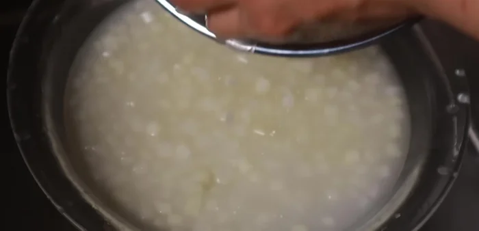 Rinse the pomelo thoroughly with water until the water runs clear.