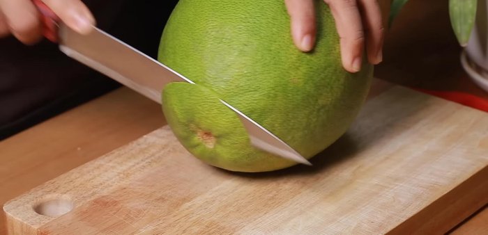 Wash the pomelo thoroughly with salt water. Keep the outer peel for tea (good for weight loss and digestion).