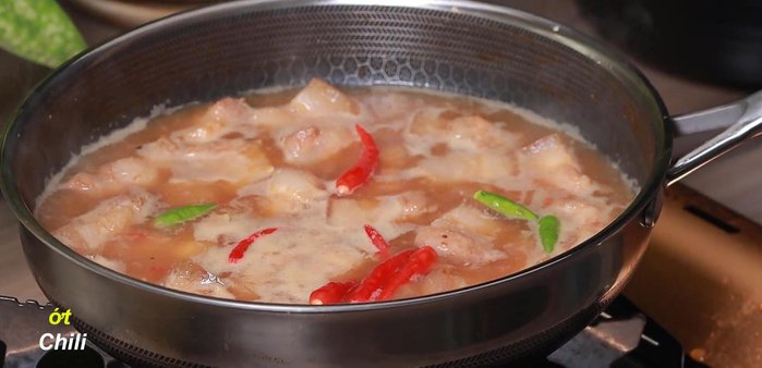 Add extra chili peppers (optional). Continue to simmer until the sauce has reduced to half its original amount.
