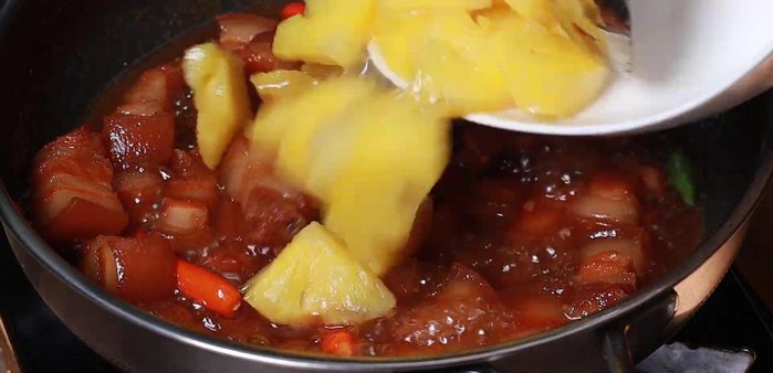 Add the stir-fried pineapple and simmer for another 5-10 minutes.
