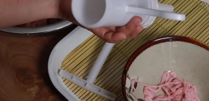 Stuff the meat mixture into fresh intestines using a sausage stuffer or piping bag.