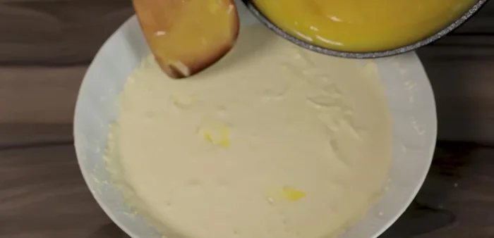 Combine Doughs: Combine the cooked dough with the cooled dough mixture. The heat from one and the coolness of the other will contribute to the cake's texture.