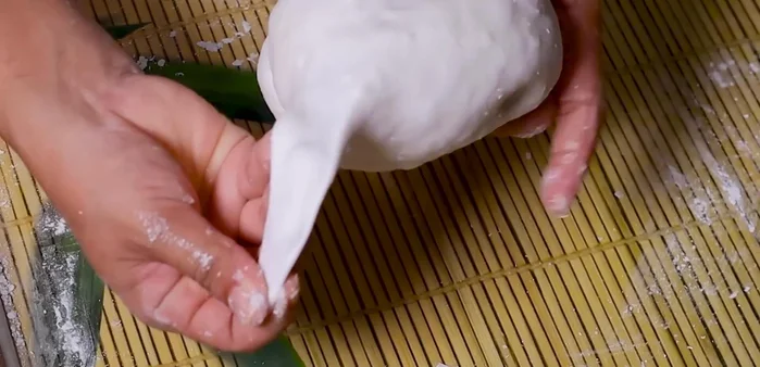 Divide the dough into portions, roll into thin circles, add filling, and seal tightly.