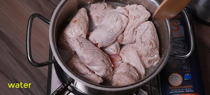 Simmer the pork: Add 2/3 of a bottle of water to the pot. Bring to a boil, then reduce heat and simmer until the pork is almost tender and the liquid is mostly absorbed. Do not add spices at this stage.