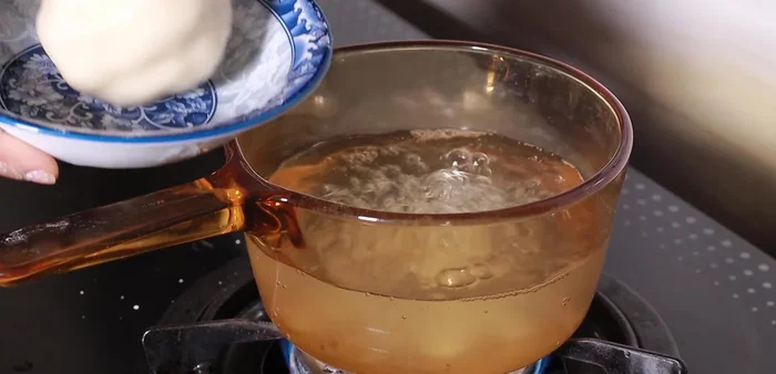 Mix the boiled dough with the remaining 2/3 of the dough to create elasticity.