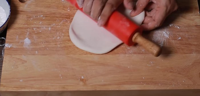 Roll out the dough very thinly.