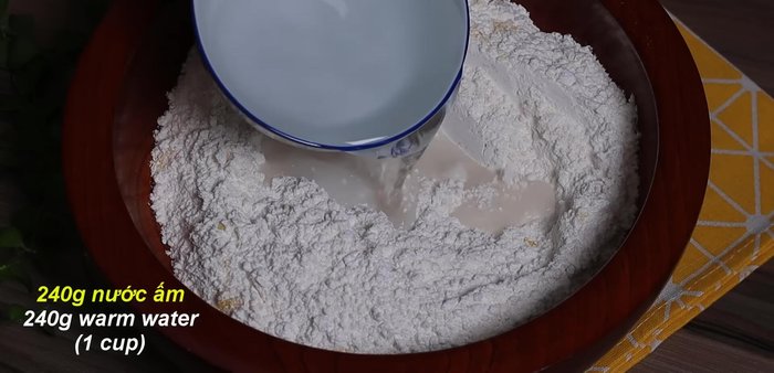 Add warm water (around 30-60°C) gradually, kneading until the dough is less sticky and doesn't adhere to the bowl (5-10 minutes).