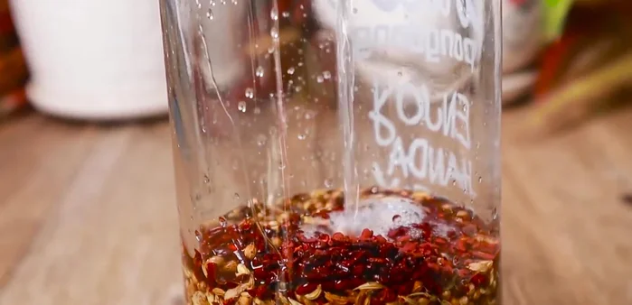 After soaking for a period (until the mixture is fragrant and a beautiful red color), pour out the wine. Add another half liter of wine for a second soak.
