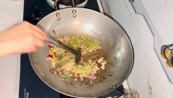 Once the fish sauce boils, add the pork belly back into the pot and simmer until the sauce thickens.