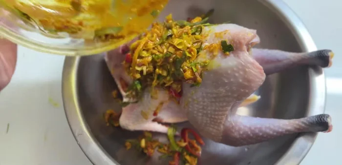 Marinate the chicken thoroughly, ensuring the marinade is spread evenly inside and out. Let it rest in the refrigerator for at least 3-4 hours.