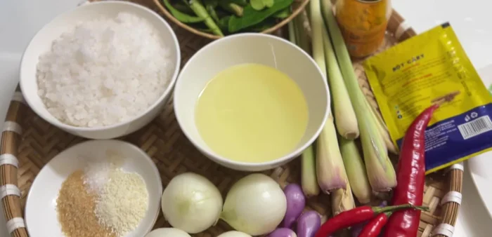Prepare the marinade: Combine salt, sugar, MSG, seasoning powder, cooking oil, five-spice powder, turmeric powder, purple onion, lemongrass, ginger, and lemon leaves.