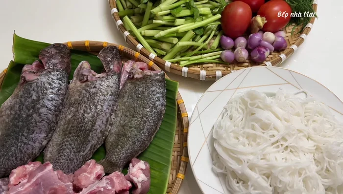 Clean the snakehead fish. Add salt and lemon, then wash with boiling water. Boil the fish with salt, seasoning powder, and ginger for about 5 minutes.