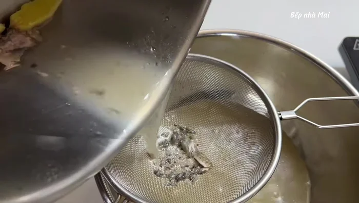 Filter the rib broth to remove bones. Use the shallots to make fried onions.