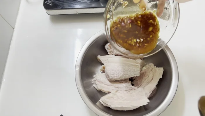 Marinate the pork belly in the prepared sauce for about 1 hour in the refrigerator.