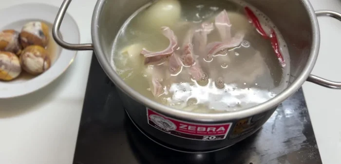 Add the duck eggs to the broth.