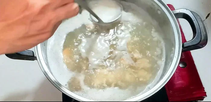Skim off the white foam to keep the soup clear.