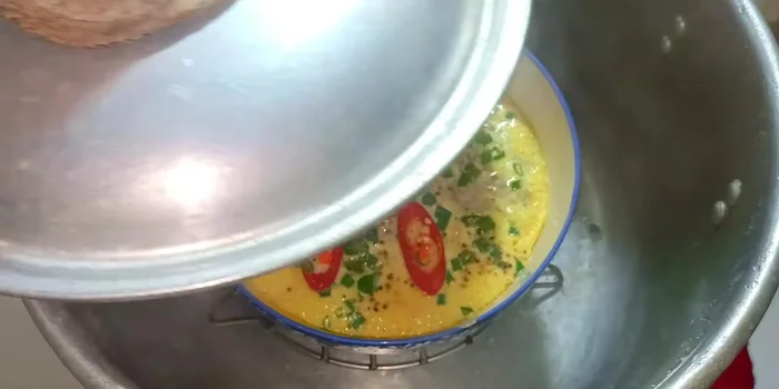 Continue steaming, covered, for another 10 minutes, briefly opening the lid halfway through to prevent excess water from dripping.