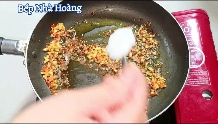 Turn off the heat. Add 2 tablespoons of sugar, 1/2 teaspoon of MSG, a little ground pepper, 2 tablespoons of fish sauce, and 1 tablespoon of Korean chili powder (or substitute).