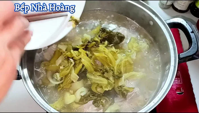 Add the pickled cabbage and tomatoes. Cover and cook until the soup boils again.