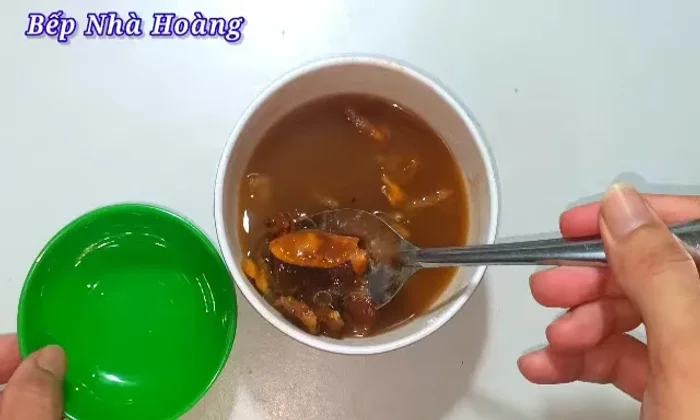 Skim off the seeds from the mashed tamarind.