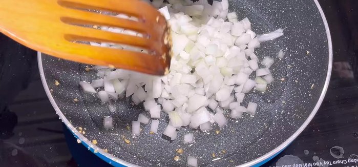 Stir-fry the chopped onion until translucent.