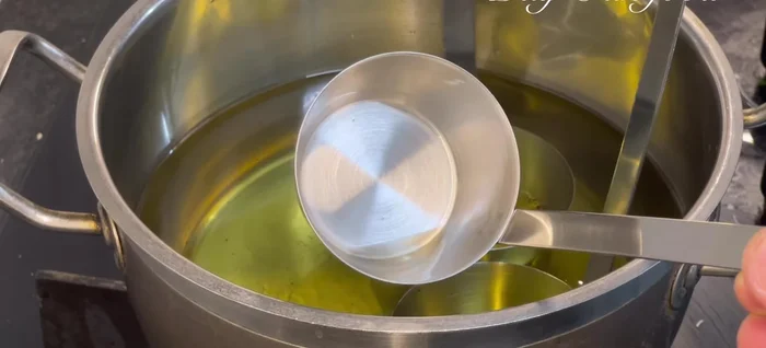 Heat oil in a frying pan with high sides.