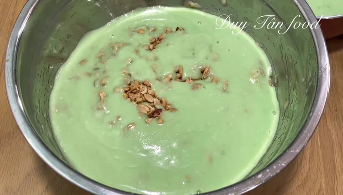 Combine ingredients: Add mashed bananas and roasted peanuts (leaving some for garnish) to the cooled coconut milk mixture. Mix well. (263.04)