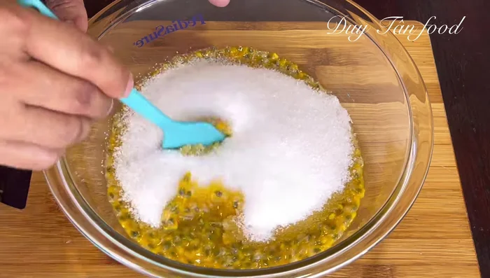 Mix passion fruit pulp and sugar: Stir until the sugar dissolves completely. Set aside to fully dissolve.