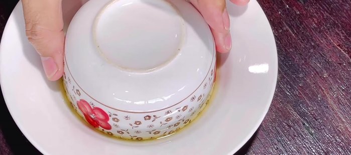 Serve: Carefully remove the steamed meatloaf from the bowl. Invert onto a plate, and top with scallion oil and roasted peanuts. Serve warm with soy sauce and chili, and grilled rice paper or fried shrimp crackers. (409.96)