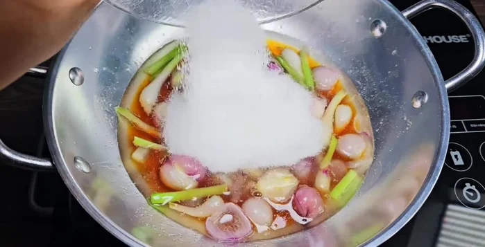 Add fish sauce, sugar, MSG, salt, and caramel water (optional). Stir until well combined.