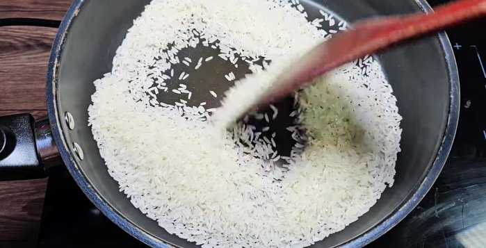 Toast the rice until fragrant. Stir constantly to prevent burning.