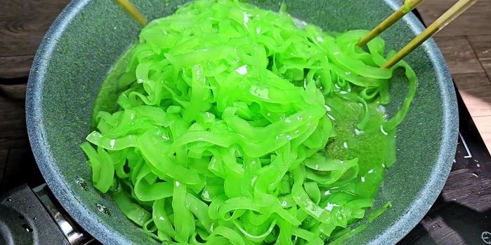 Continue stirring until the jam is dry and forms sugar threads. This takes patience and continuous stirring to avoid burning.