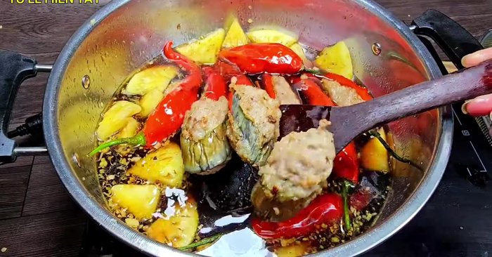 Combine and simmer: Add the fried chili, eggplant, and bitter melon into the sauce. Simmer until the sauce thickens. Stir occasionally.