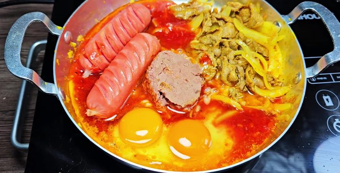 Add eggs: Crack eggs into the pan and cook to your preference (sunny-side up or fully cooked).