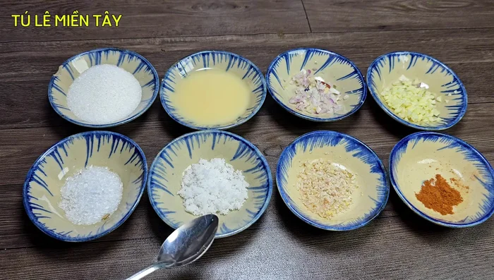 In a bowl, mix sugar, MSG, salt, condensed milk, minced shallots, lemongrass, garlic, and five-spice powder.