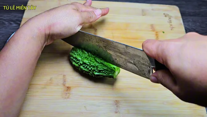 Prepare the bitter melon: Cut off the ends, slice in half lengthwise, and then cut into small pieces. Remove seeds if desired.