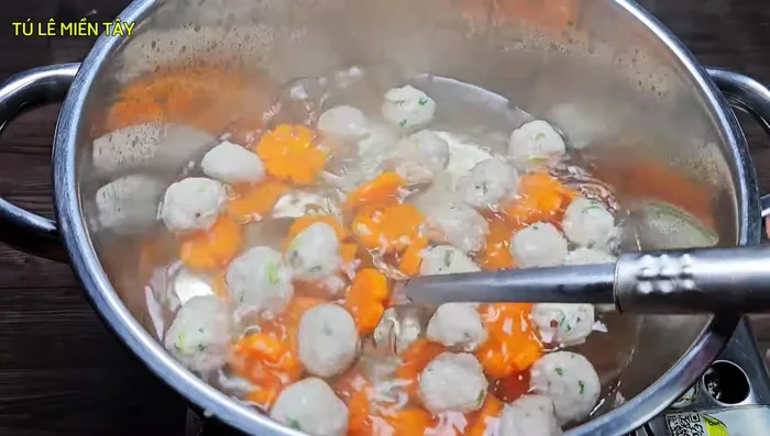 Add carrots to the boiling water and cook until slightly softened.