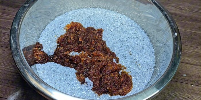 Once the sugar syrup has cooled, add the drained basil seeds and prepared baobab seeds. Stir well to combine.