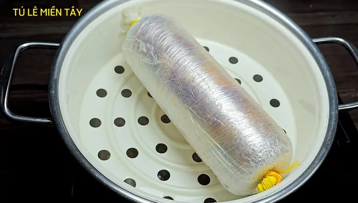 Steam the rolled chicken in boiling water for 45 minutes.