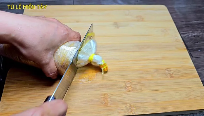 Remove the chicken and let it cool slightly before cutting open the plastic wrap.