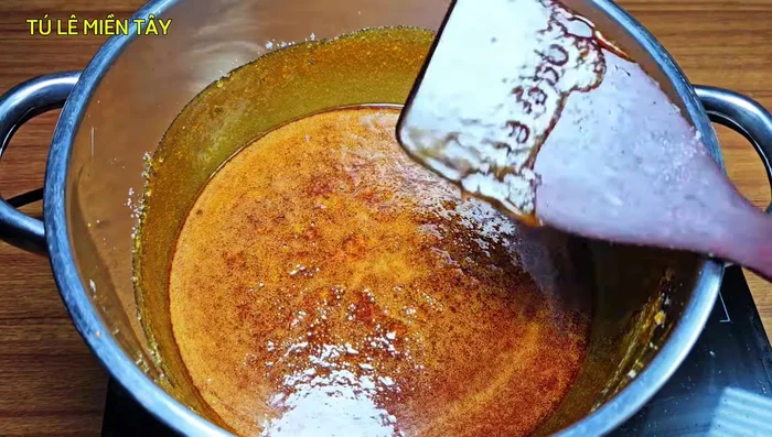 The sugar will begin to boil. Use a large pot to prevent it from overflowing as it expands.