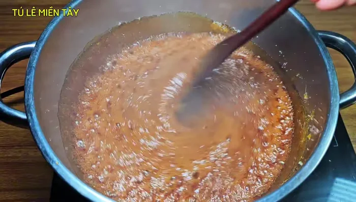 Reduce the heat to medium-low to prevent burning and achieve a beautiful color. Cook slowly to develop the caramel's rich color.