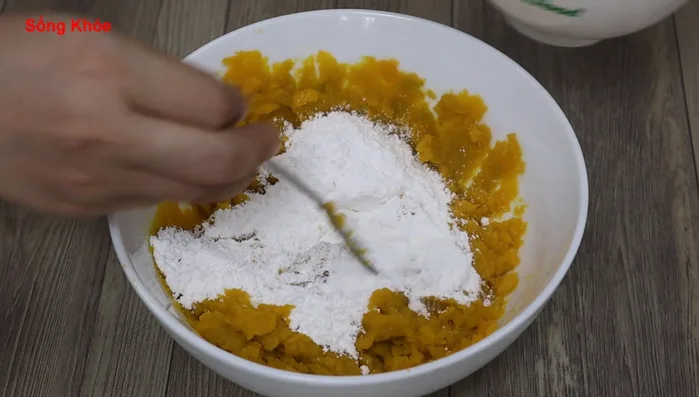 Add sticky rice flour (or tapioca starch) slowly and mix until the dough is sticky.