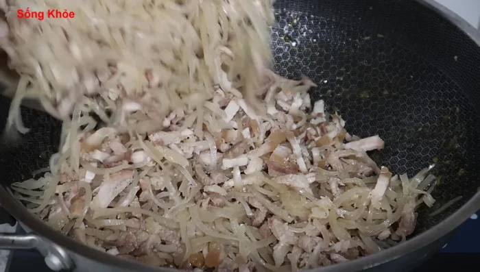 Combine pork and pork skin: In the pan with remaining spices, combine the pork skin and pork. Stir-fry over low heat for about 5 minutes until the pork skin releases its resin.