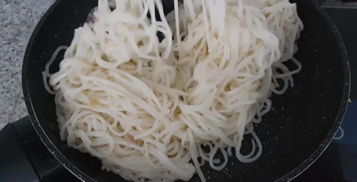 Stir-fry the noodles until heated through. Be careful not to overcook.