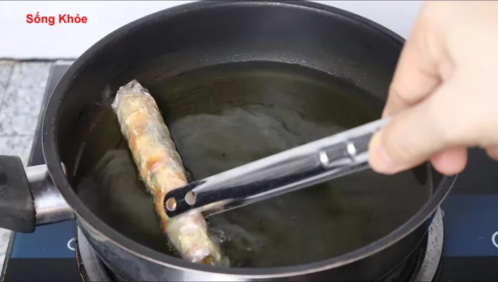 Heat oil in a pan. Fry the rice paper rolls over medium heat until golden brown and crispy.