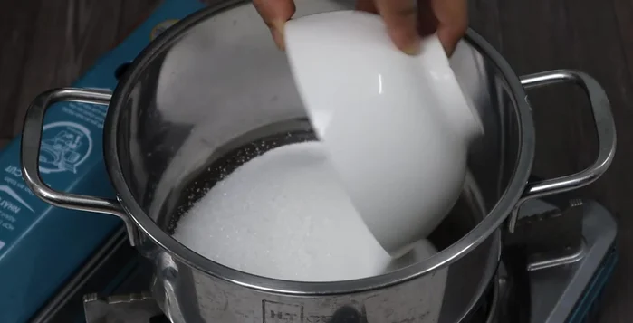 Prepare the soaking liquid: Combine sugar, water, and soy sauce in a pot. Cook until the sugar dissolves completely (about 2 minutes). Let cool completely.